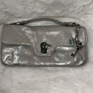 Juicy Couture NWOT silver genuine leather clutch/crossbody bag with charm